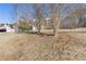 House exterior showcasing landscaping and a long driveway at 135 Trelawney Pl, Covington, GA 30016