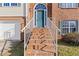 Brick steps and railing leading to the front entrance of the home at 135 Trelawney Pl, Covington, GA 30016