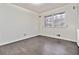 Simple bedroom with hardwood floors and large windows at 2973 Payton Ne Rd, Atlanta, GA 30345