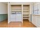 Laundry area with built-in shelving and washer/dryer at 2973 Payton Ne Rd, Atlanta, GA 30345