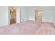 Large living room with carpet and access to other rooms at 2973 Payton Ne Rd, Atlanta, GA 30345