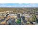 Aerial view of a town center with shops and a central green space at 3051 Maple Ln, Alpharetta, GA 30009