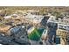 Aerial view of a charming town center with shops and a park at 3051 Maple Ln, Alpharetta, GA 30009