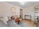 Relaxing basement sitting area with sectional sofa and decor at 3051 Maple Ln, Alpharetta, GA 30009