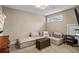 Cozy basement rec room with sectional sofa and ottoman at 3051 Maple Ln, Alpharetta, GA 30009