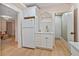 Basement kitchenette with white cabinets and gold faucet at 3051 Maple Ln, Alpharetta, GA 30009