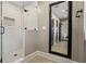 Clean bathroom with white subway tile shower and large mirror at 3051 Maple Ln, Alpharetta, GA 30009