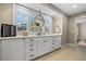 Modern bathroom with white cabinets and hexagon tile floors at 3051 Maple Ln, Alpharetta, GA 30009