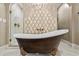 Luxurious bathroom featuring a freestanding tub and a marble shower at 3051 Maple Ln, Alpharetta, GA 30009