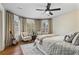Spacious bedroom with hardwood floors and large windows at 3051 Maple Ln, Alpharetta, GA 30009