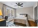 Comfortable bedroom with hardwood floors and large windows at 3051 Maple Ln, Alpharetta, GA 30009
