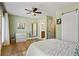Light and airy bedroom with wood floors and access to private bathroom at 3051 Maple Ln, Alpharetta, GA 30009