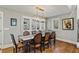 Dining room with a large table, leather chairs, and hardwood floors at 3051 Maple Ln, Alpharetta, GA 30009