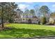 Two-story house with a large green lawn at 3051 Maple Ln, Alpharetta, GA 30009