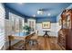 Bright home office featuring built-in shelving and hardwood floors at 3051 Maple Ln, Alpharetta, GA 30009