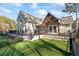 Exterior view of a charming house with a deck and fenced backyard at 3051 Maple Ln, Alpharetta, GA 30009