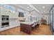 Modern kitchen with stainless steel appliances, white cabinets and hardwood floors at 3051 Maple Ln, Alpharetta, GA 30009