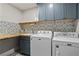 Laundry room with butcher block countertop and updated appliances at 3051 Maple Ln, Alpharetta, GA 30009
