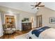 Bright and airy main bedroom with a comfortable sitting area and walk-in closet at 3051 Maple Ln, Alpharetta, GA 30009
