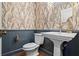 Stylish powder room with pedestal sink and patterned wallpaper at 3051 Maple Ln, Alpharetta, GA 30009