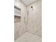 Spa-like shower with marble walls and gold fixtures at 3051 Maple Ln, Alpharetta, GA 30009