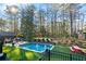 Inviting swimming pool with a wooden deck and picnic table at 3051 Maple Ln, Alpharetta, GA 30009