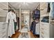 Spacious walk-in closet with ample shelving and hanging space at 3051 Maple Ln, Alpharetta, GA 30009