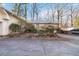 Side view of the house, showing landscaping and driveway at 911 Vistavia Cir, Decatur, GA 30033