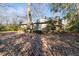 Ranch house back view, surrounded by trees and yard at 911 Vistavia Cir, Decatur, GA 30033