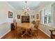 Classic dining room with hardwood floors and a chandelier at 2368 Peeler Rd, Dunwoody, GA 30338