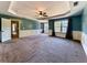 Main bedroom with carpet, door to hallway and multiple windows at 245 George Wynn Rd, Palmetto, GA 30268