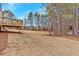 Backyard view of new home with deck and open space at 4434 Sullivan Rd, Powder Springs, GA 30127