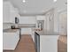 Modern kitchen with white cabinets, granite counters and stainless steel appliances at 4434 Sullivan Rd, Powder Springs, GA 30127