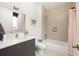 Stylish bathroom with a modern vanity, a tiled shower-tub, and chic fixtures that offers a blend of comfort and style at 122 Gainey Ln, Chattahoochee Hills, GA 30268