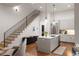 Bright kitchen with stainless steel appliances, marble countertop island, and hardwood floors at 122 Gainey Ln, Chattahoochee Hills, GA 30268