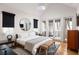 Bright main bedroom featuring high ceilings, french doors, and stylish furnishings at 122 Gainey Ln, Chattahoochee Hills, GA 30268
