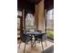 Inviting screened porch with black wicker table and chairs at 122 Gainey Ln, Chattahoochee Hills, GA 30268