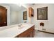 Bathroom with wooden vanity, large mirror, and toilet at 1836 Poinsetta Dr, Acworth, GA 30102
