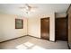 Simple bedroom with carpet flooring and a ceiling fan at 1836 Poinsetta Dr, Acworth, GA 30102