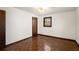 Bright bedroom featuring hardwood floors and a ceiling fan at 1836 Poinsetta Dr, Acworth, GA 30102