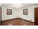 Spacious bedroom with parquet flooring, ceiling fan, and ample natural light at 1836 Poinsetta Dr, Acworth, GA 30102