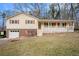 Ranch house with brick and siding, covered porch, and attached garage at 1836 Poinsetta Dr, Acworth, GA 30102