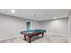 Finished basement area featuring a classic pool table, perfect for entertainment at 785 Charleston Dr, Roswell, GA 30075