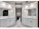 Bright bathroom with dual vanities, large mirrors, and a view into the connected bedroom space at 785 Charleston Dr, Roswell, GA 30075