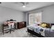 Comfortable bedroom with neutral carpet, large window, and ample space for a desk and dresser at 785 Charleston Dr, Roswell, GA 30075
