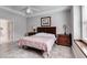 Comfortable bedroom featuring a traditional bed, a ceiling fan, and bright natural light at 785 Charleston Dr, Roswell, GA 30075