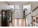 Spacious foyer with high ceilings, hardwood floors, and arched doorways leading to other rooms at 785 Charleston Dr, Roswell, GA 30075