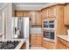 Modern kitchen featuring stainless steel appliances, gas cooktop, and ample counter space at 785 Charleston Dr, Roswell, GA 30075