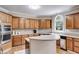 Well-equipped kitchen featuring ample cabinet space, stainless steel appliances, and a breakfast bar at 785 Charleston Dr, Roswell, GA 30075