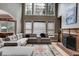 Inviting living room with a fireplace, large windows, and plush sectional sofa at 785 Charleston Dr, Roswell, GA 30075